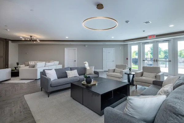 a living room with furniture and a large window