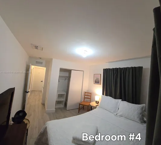 a living room with a couch and a dresser