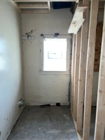 a view of a room with wooden walls