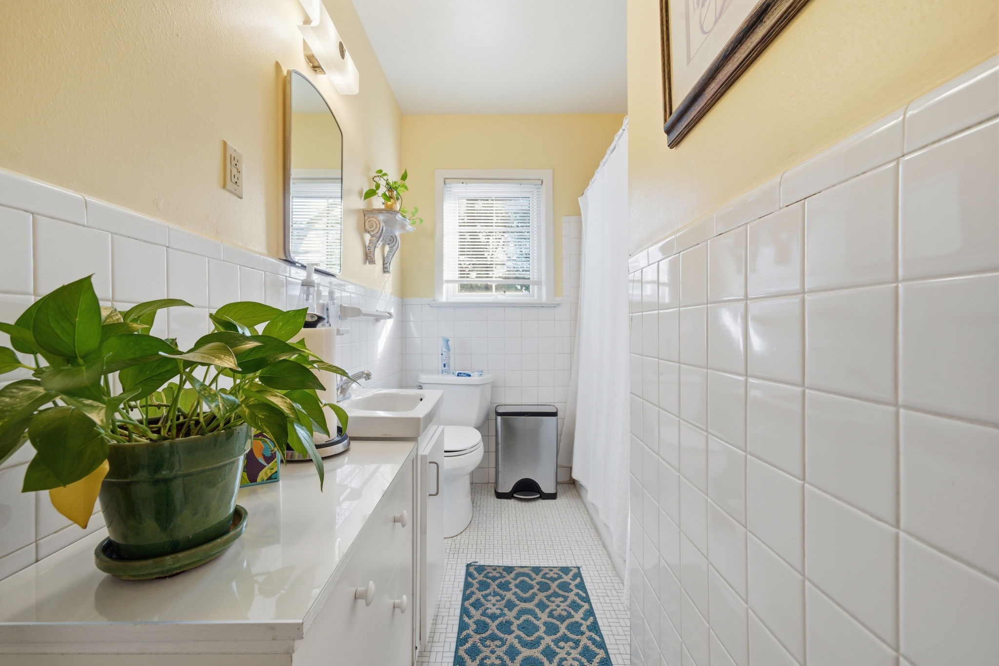 1801 Lexington Street Houston, TX 77098 - Photo 16 of 50 a white bath tub sitting next to a white toilet
