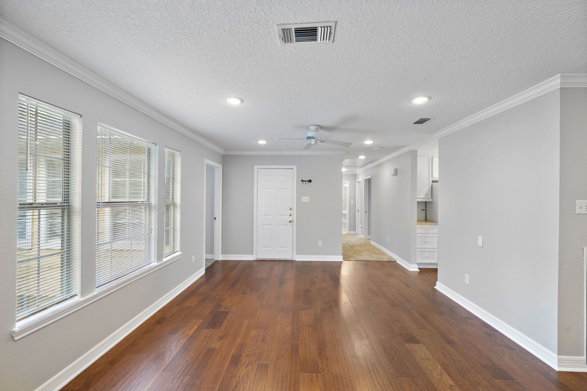 1801 Lexington Street Houston, TX 77098 - Photo 30 of 50 a view of an empty room with wooden floor and a window
