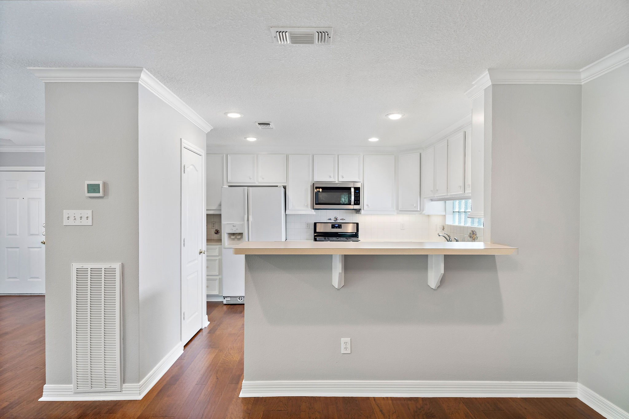 1801 Lexington Street Houston, TX 77098 - Photo 31 of 50 a kitchen with stainless steel appliances a sink a stove a refrigerator and cabinets