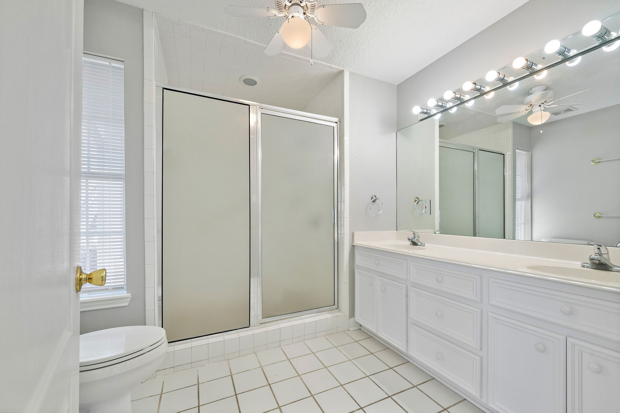 1801 Lexington Street Houston, TX 77098 - Photo 34 of 50 a bathroom with a double vanity sink mirror and shower