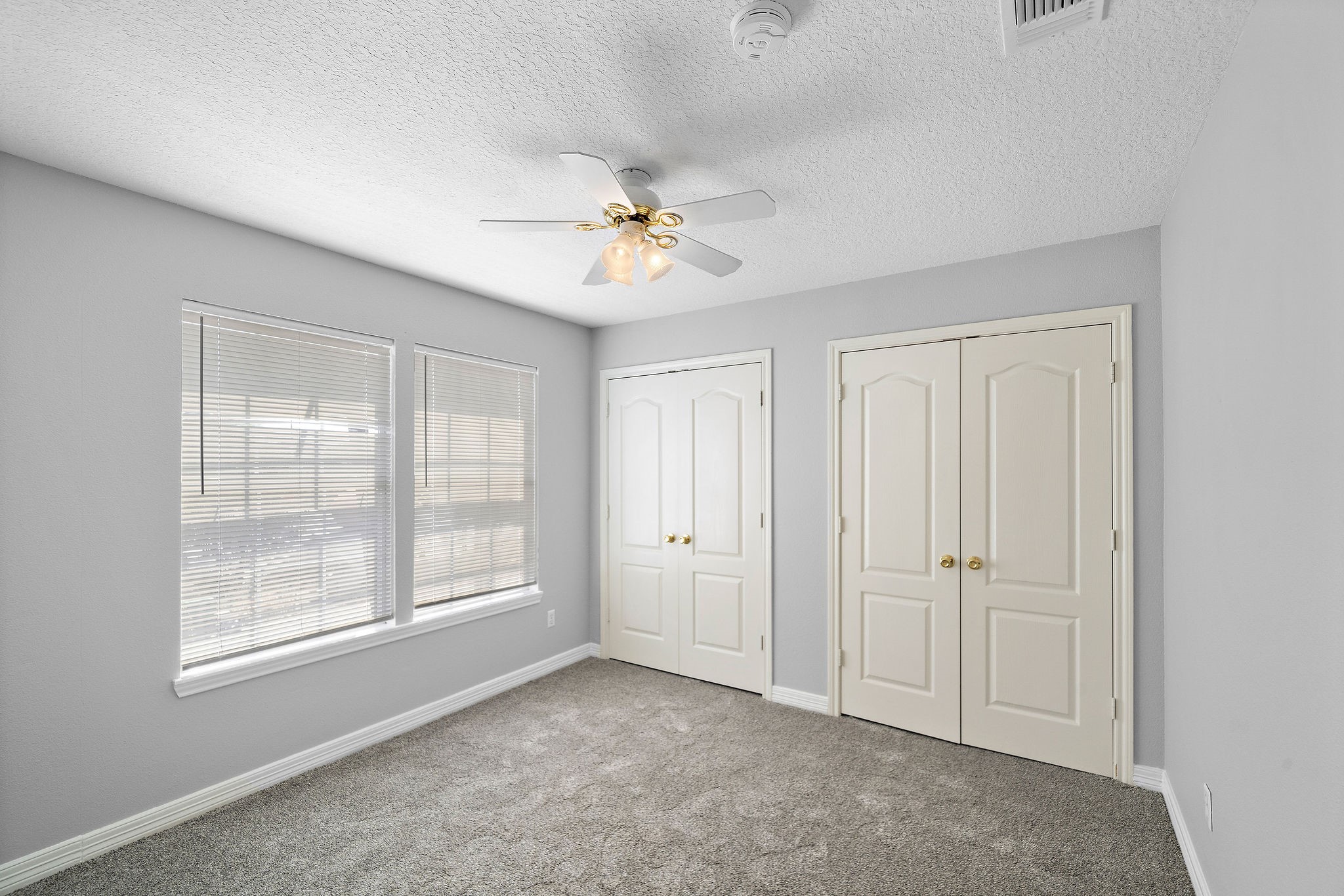 1801 Lexington Street Houston, TX 77098 - Photo 37 of 50 an empty room with chandelier fan and windows