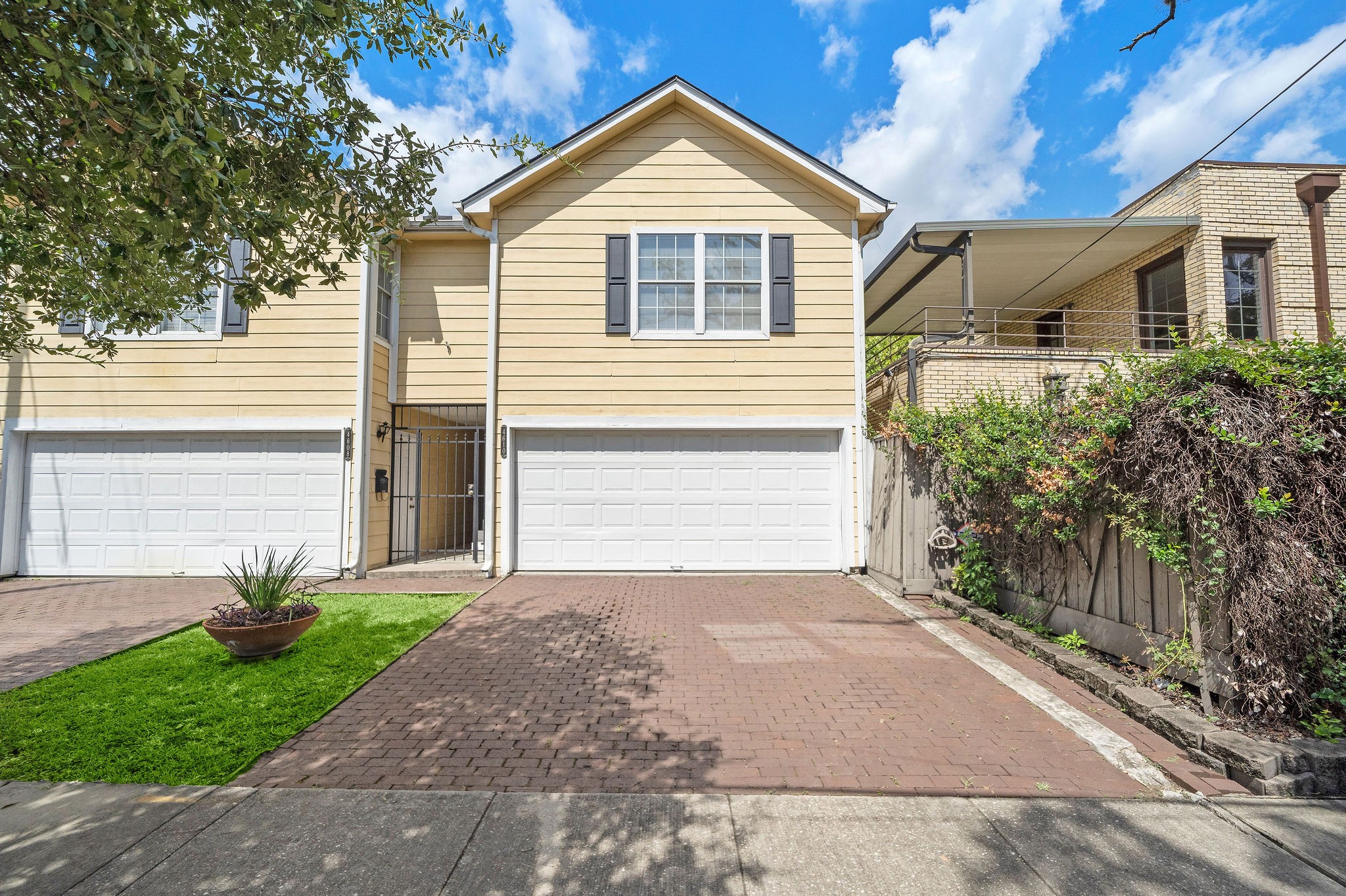 1801 Lexington Street Houston, TX 77098 - Photo 4 of 50 a front view of a house with a yard and garage