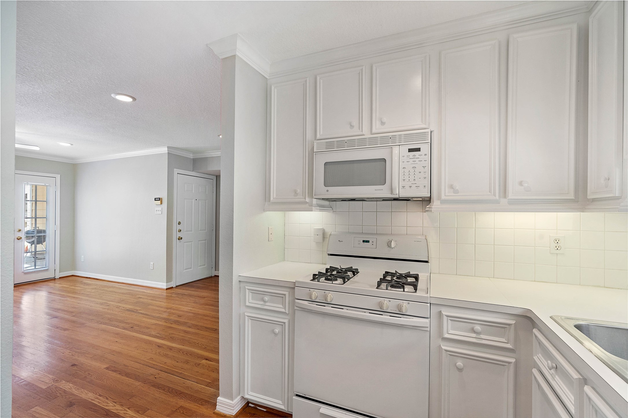 1801 Lexington Street Houston, TX 77098 - Photo 46 of 50 a kitchen with appliances cabinets and a counter top space