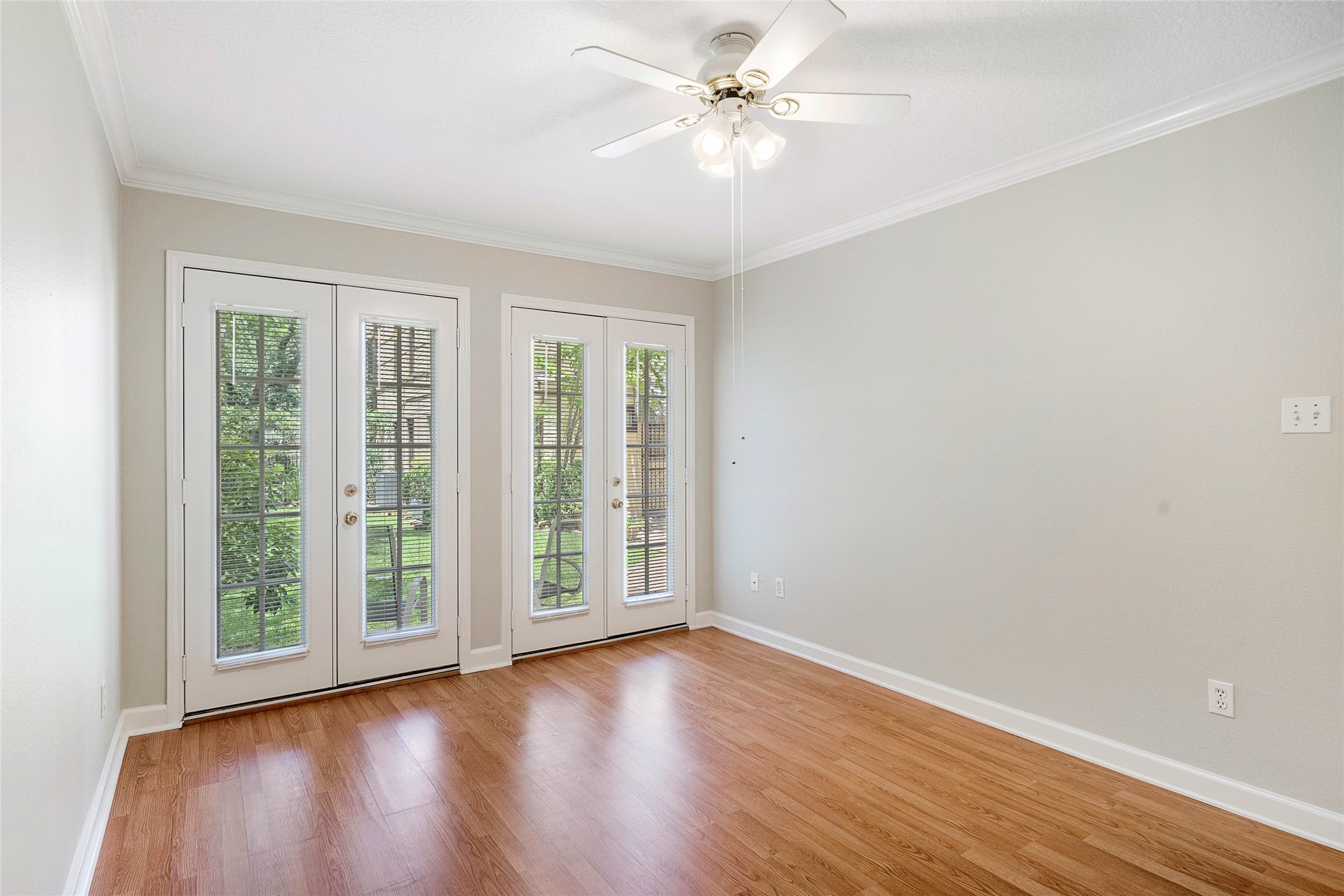1801 Lexington Street Houston, TX 77098 - Photo 47 of 50 an empty room with wooden floor fan and windows