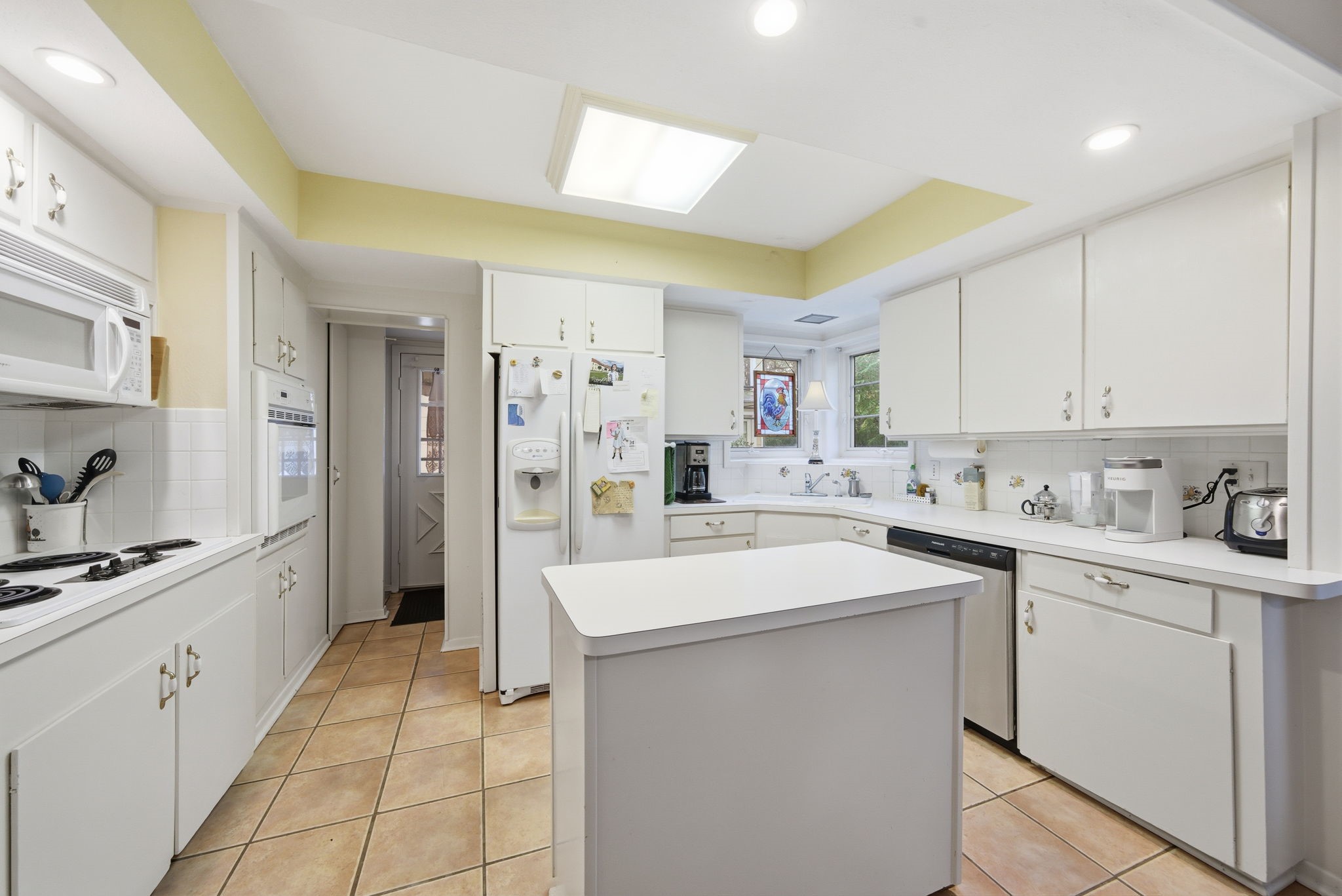 1801 Lexington Street Houston, TX 77098 - Photo 9 of 50 a kitchen with white cabinets appliances and sink