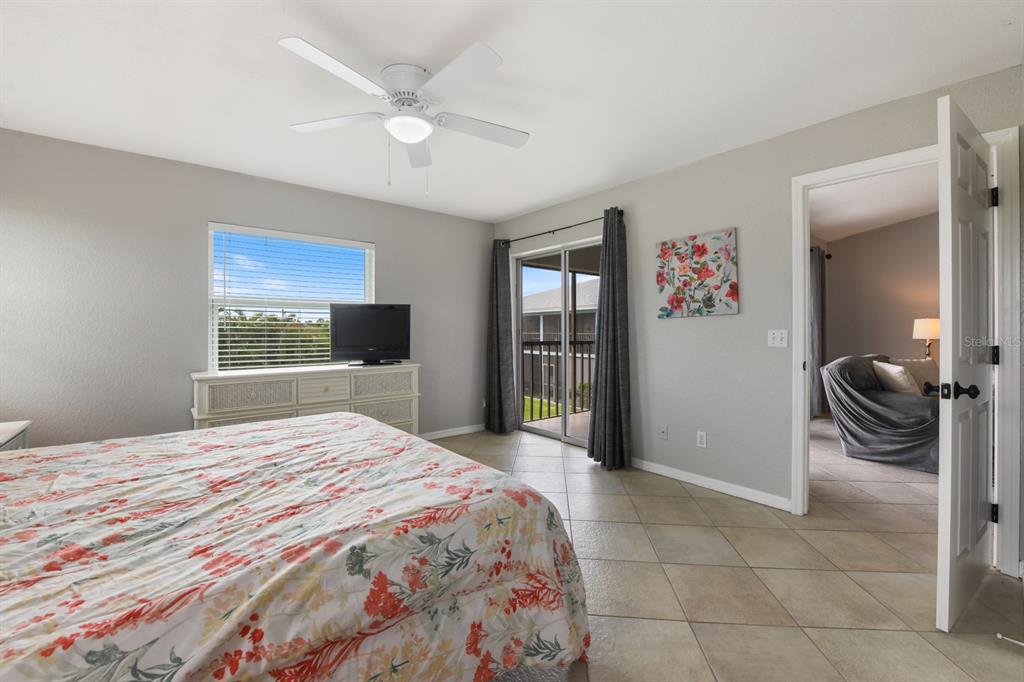 449 Royal Poinciana, Unit 221 Punta Gorda, FL 33955 - Photo 11 of 17 a bedroom with a bed and a window