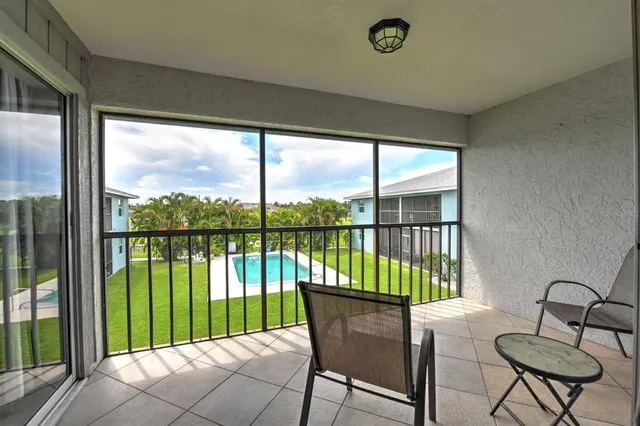 a house view with a seating space and hardwood floor