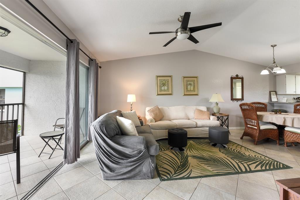 449 Royal Poinciana, Unit 221 Punta Gorda, FL 33955 - Photo 7 of 17 a living room with furniture a ceiling fan and a rug