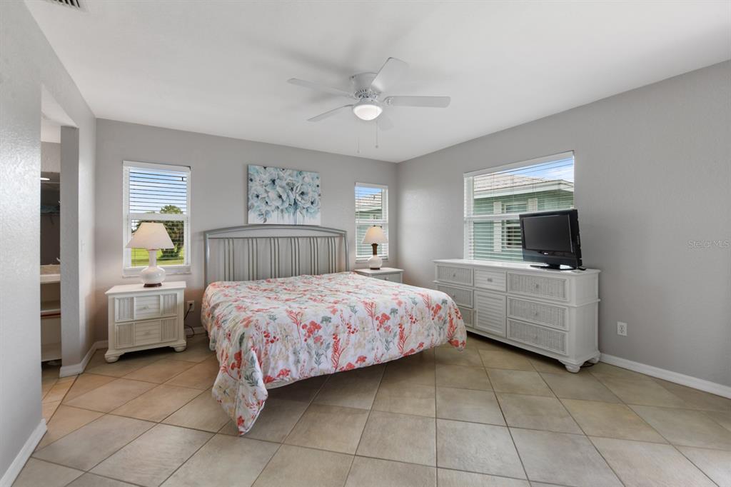 449 Royal Poinciana, Unit 221 Punta Gorda, FL 33955 - Photo 8 of 17 a bedroom with a bed and a couch