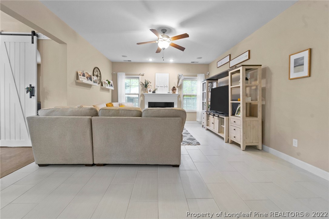 60 Shellbark Drive Spring Lake, NC 28390 - Photo 16 of 42 a living room with furniture and a ceiling fan