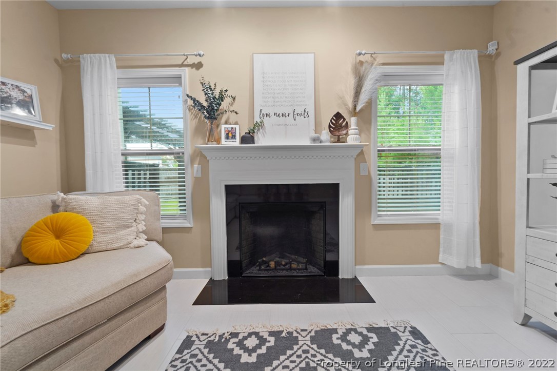 60 Shellbark Drive Spring Lake, NC 28390 - Photo 18 of 42 a living room with a couch and a fireplace