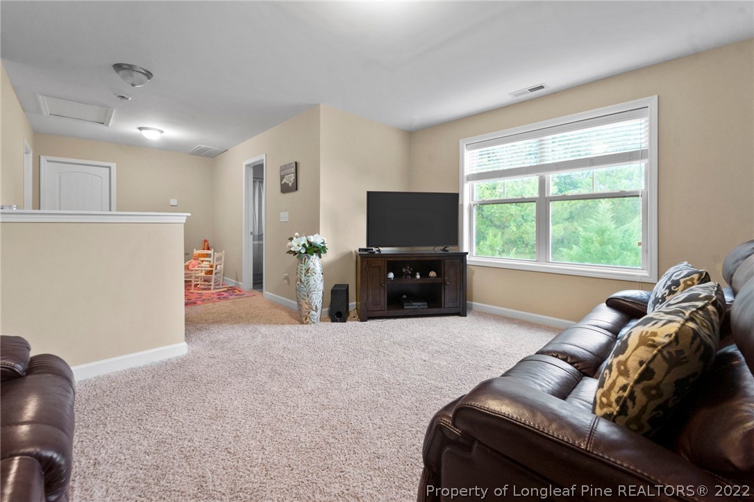 60 Shellbark Drive Spring Lake, NC 28390 - Photo 25 of 42 a living room with furniture and a flat screen tv