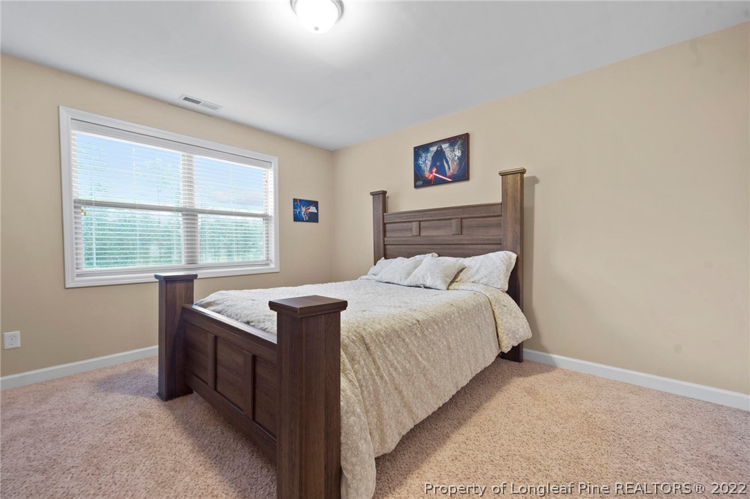 60 Shellbark Drive Spring Lake, NC 28390 - Photo 27 of 42 a bedroom with a bed and a window