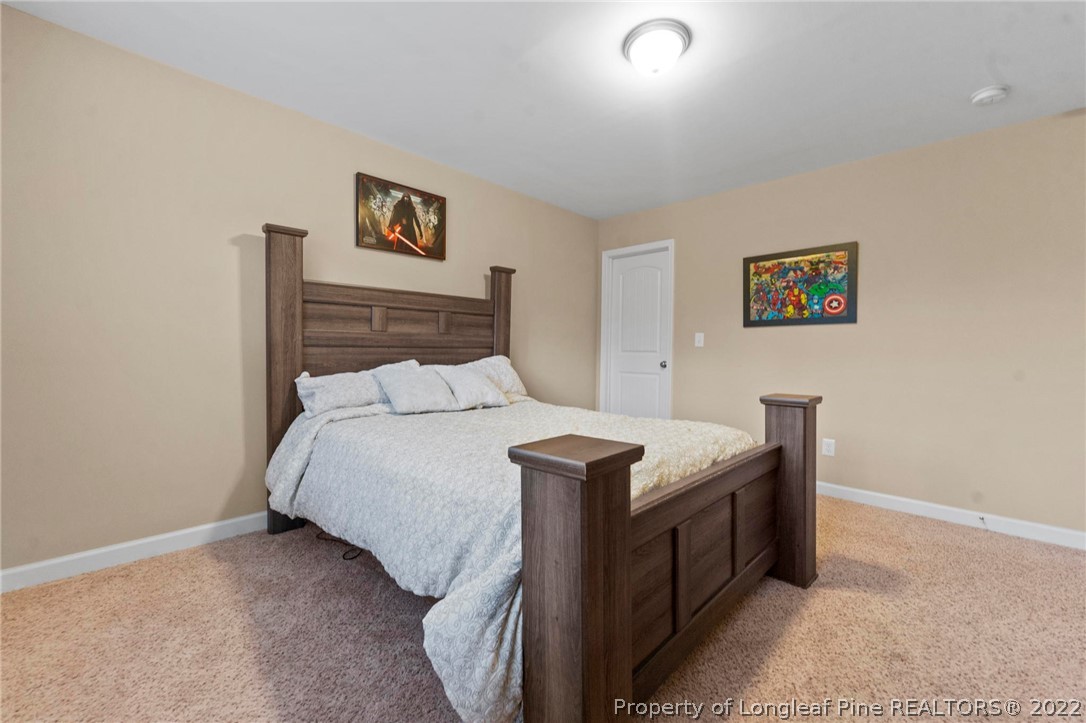 60 Shellbark Drive Spring Lake, NC 28390 - Photo 28 of 42 a bedroom with a bed and a furniture