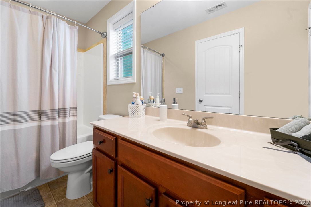 60 Shellbark Drive Spring Lake, NC 28390 - Photo 29 of 42 a bathroom with a sink toilet and shower