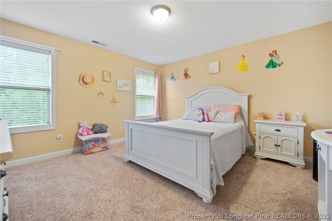 60 Shellbark Drive Spring Lake, NC 28390 - Photo 31 of 42 a bedroom with a bed and a window