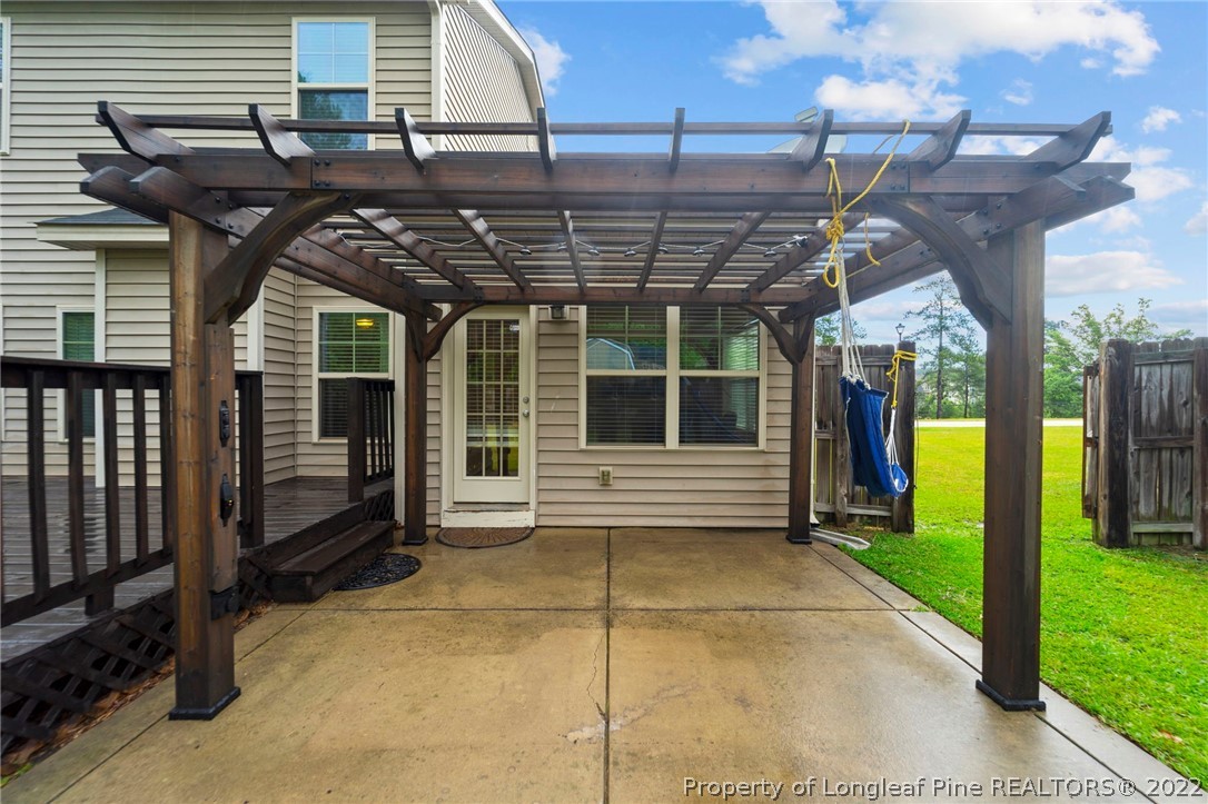 60 Shellbark Drive Spring Lake, NC 28390 - Photo 36 of 42 a view of a porch with a table and a chair