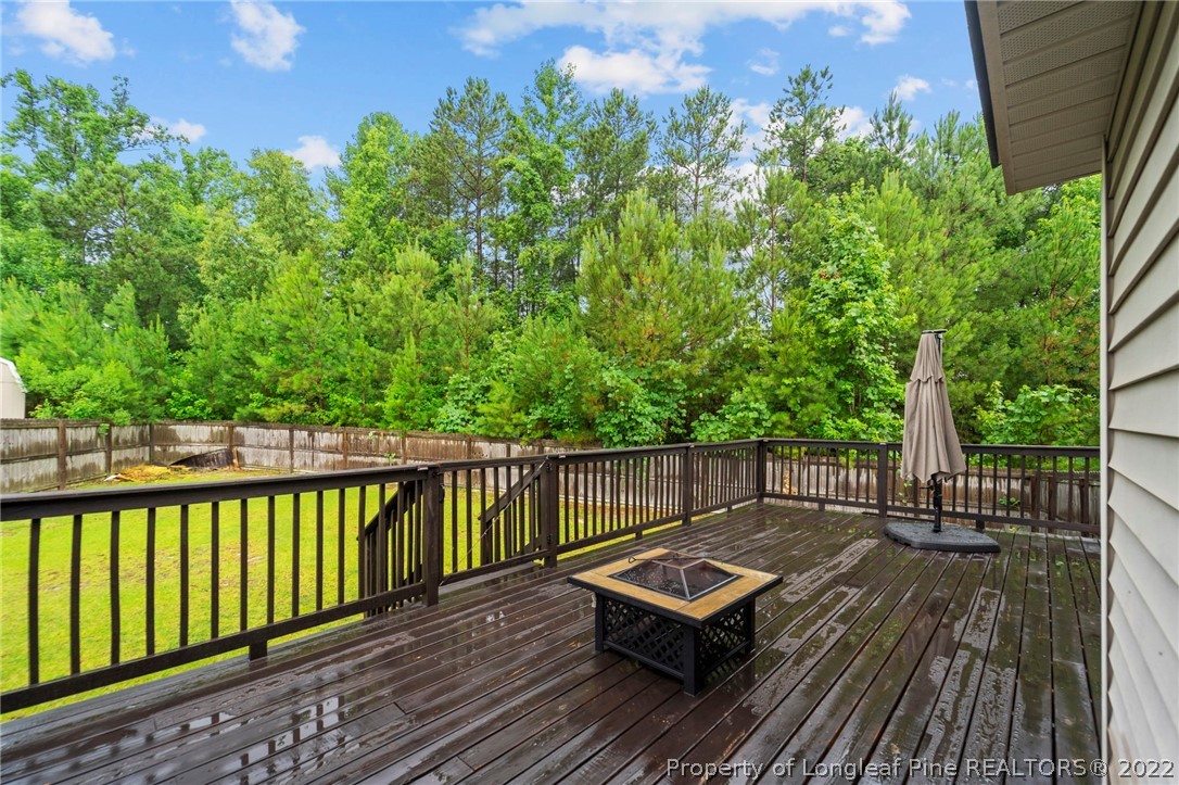 60 Shellbark Drive Spring Lake, NC 28390 - Photo 37 of 42 a view of a wooden deck with a bench