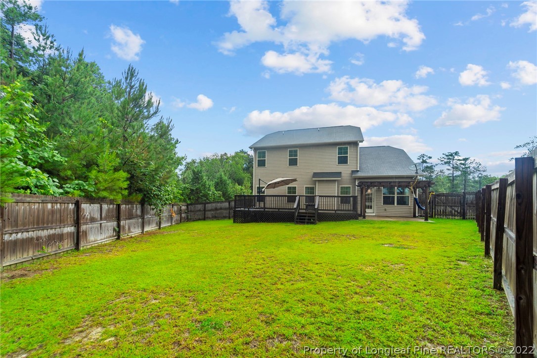 60 Shellbark Drive Spring Lake, NC 28390 - Photo 42 of 42 a view of a house with a yard porch and sitting area