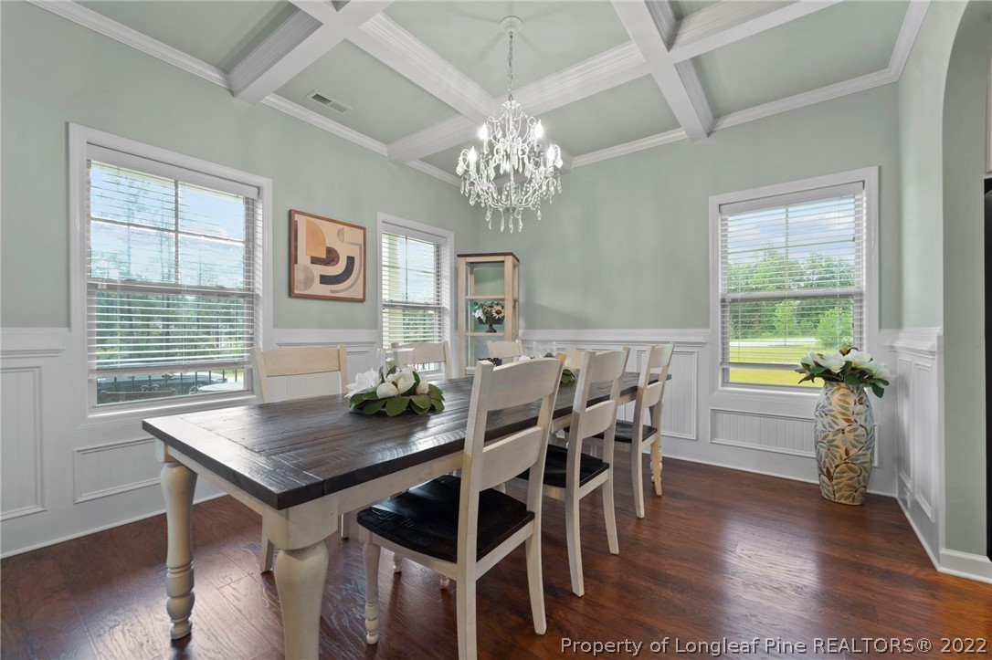 60 Shellbark Drive Spring Lake, NC 28390 - Photo 8 of 42 a view of a dining room with furniture and wooden floor