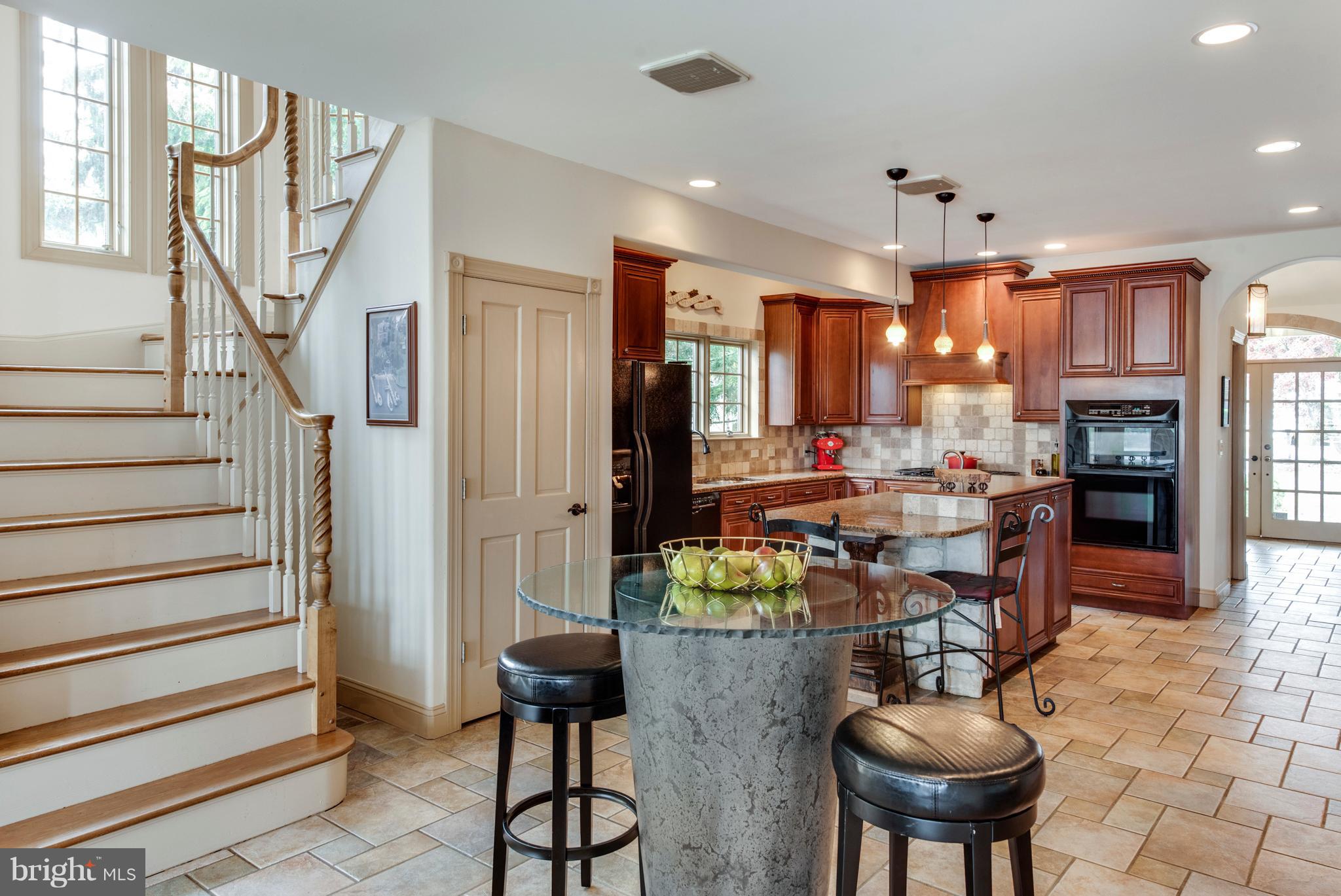 1795 Beachfield Road Annapolis, MD 21409 - Photo 21 of 49 a room with stainless steel appliances kitchen island granite countertop furniture and a view of kitchen