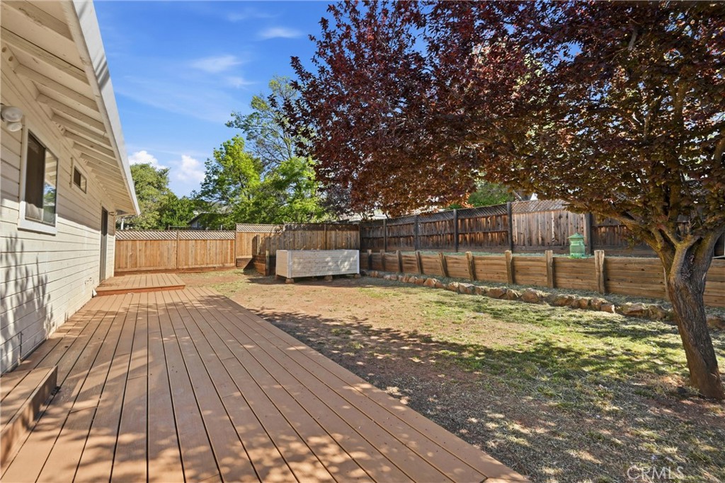 19176 Stonegate Road Hidden Valley Lake, CA 95467 - Photo 20 of 26 Backyard has lovely deck and flat area for play.