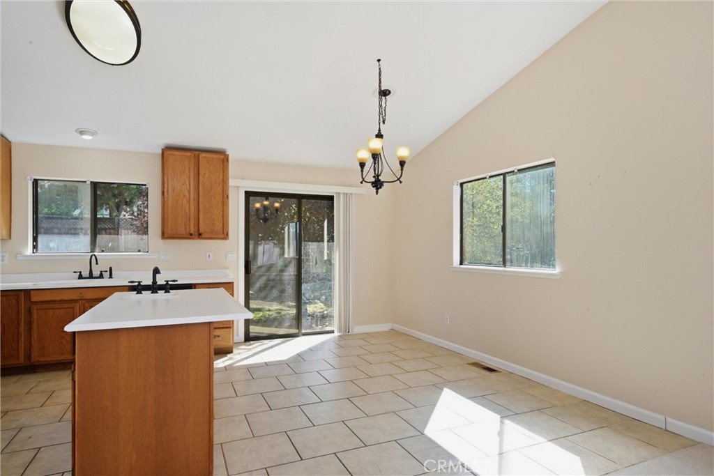 19176 Stonegate Road Hidden Valley Lake, CA 95467 - Photo 7 of 26 Dining area has breakfast bar and slider to back yard.