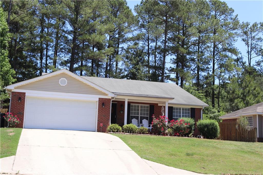 2704 Davis Mill Road Hephzibah, GA 30815 - Photo 1 of 1 a front view of a house with garden