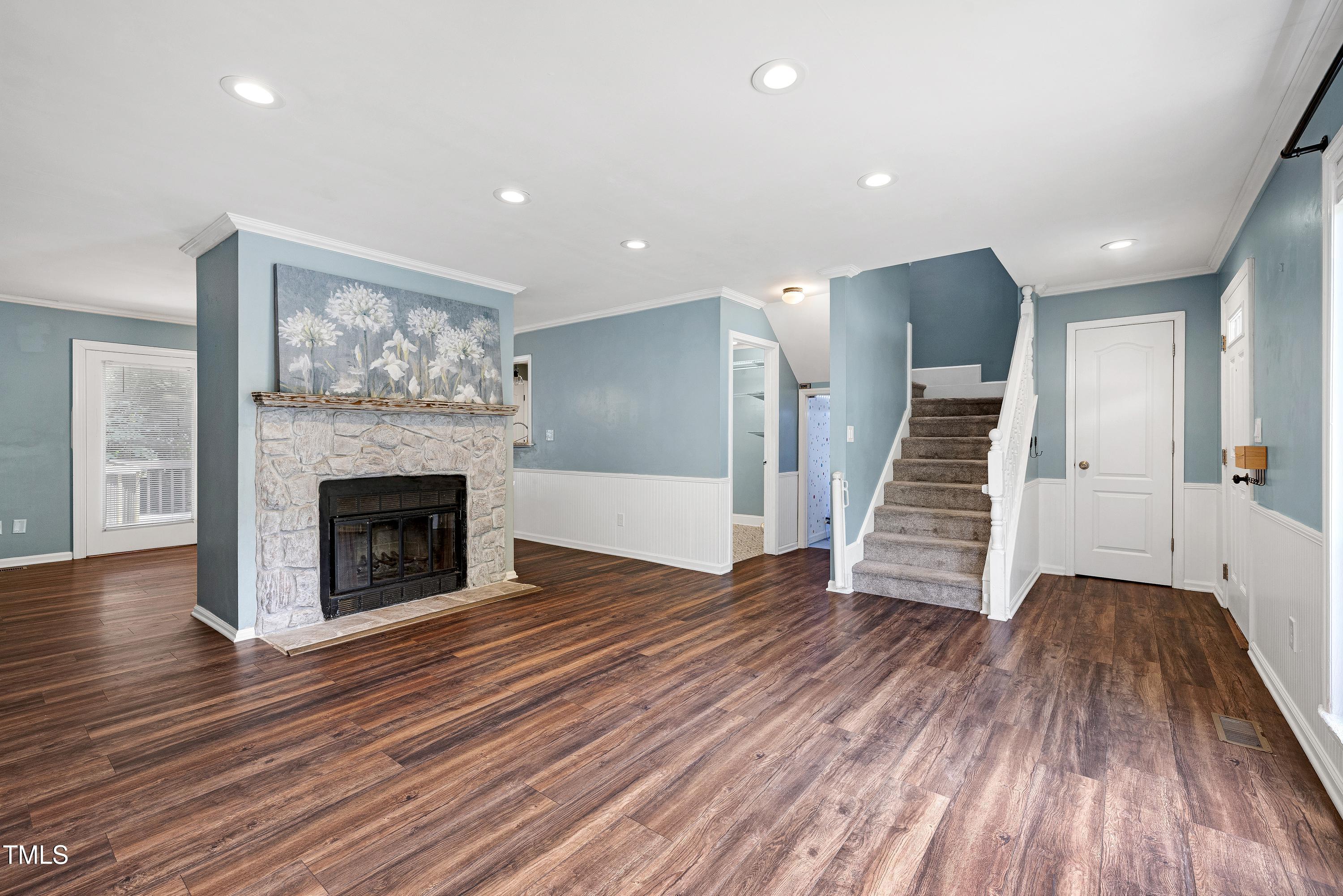 119 Joanne Circle Cary, NC 27513 - Photo 6 of 42 a view of a livingroom with wooden floor and a fireplace