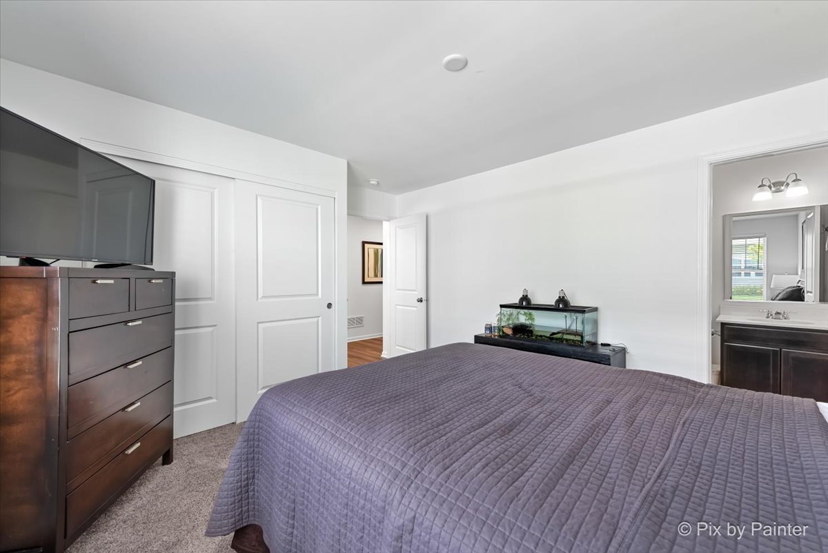 462 Comstock Road South Elgin, IL 60177 - Photo 12 of 23 a bedroom with a bed and dresser