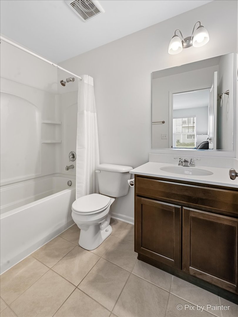 462 Comstock Road South Elgin, IL 60177 - Photo 13 of 23 a bathroom with a sink toilet a mirror and shower