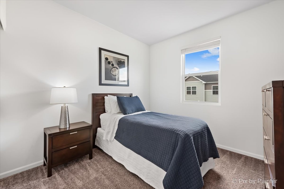 462 Comstock Road South Elgin, IL 60177 - Photo 15 of 23 a spacious bedroom with a bed and a window