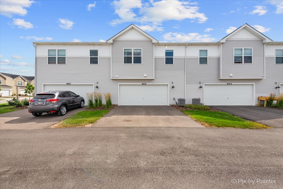 462 Comstock Road South Elgin, IL 60177 - Photo 22 of 23 a front view of a house with a yard and garage
