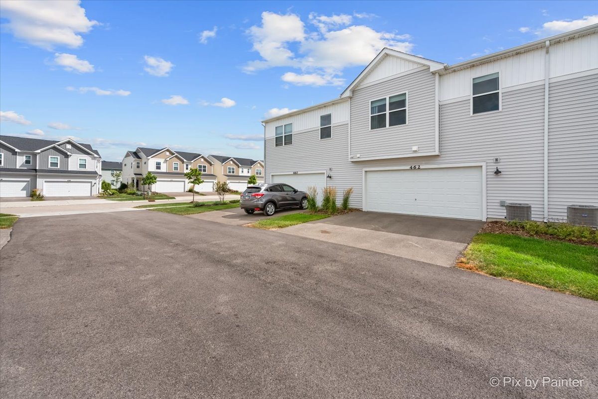 462 Comstock Road South Elgin, IL 60177 - Photo 23 of 23 a view of a house with a yard and parking
