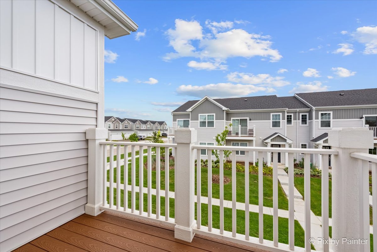462 Comstock Road South Elgin, IL 60177 - Photo 3 of 23 a view of a white house with wooden fence