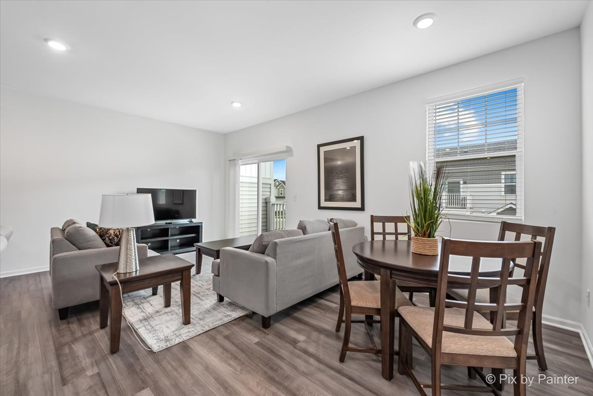 462 Comstock Road South Elgin, IL 60177 - Photo 7 of 23 a living room with furniture a flat screen tv and a window