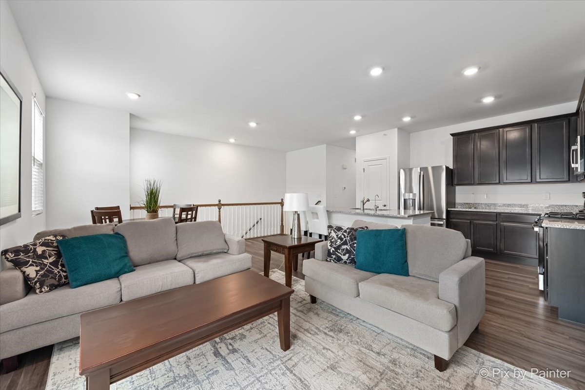 462 Comstock Road South Elgin, IL 60177 - Photo 9 of 23 a living room with furniture and kitchen view