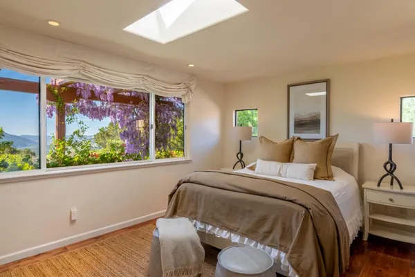 a bedroom with a bed and window