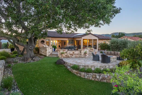a view of a house with swimming pool and porch