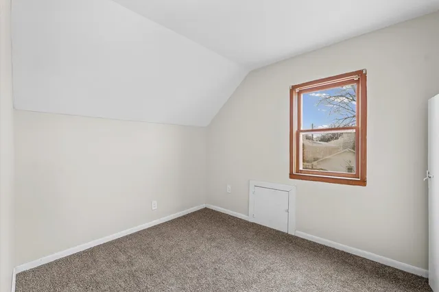 a view of steet with seating area