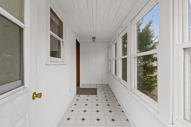 a bathroom with a bathtub and a window
