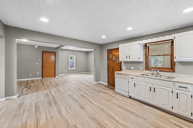 a white refrigerator freezer sitting inside of a kitchen