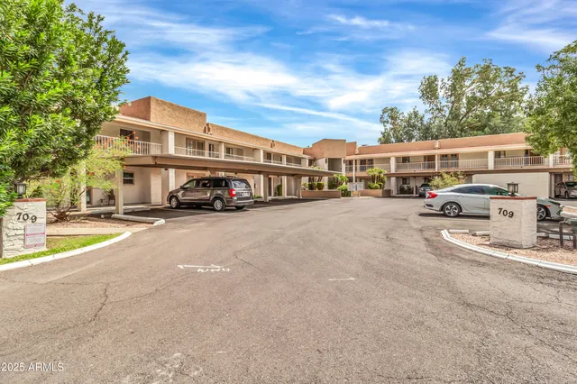 front view of a building with a garden