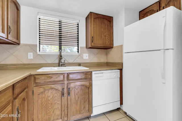 a view of a kitchen with a refrigerator
