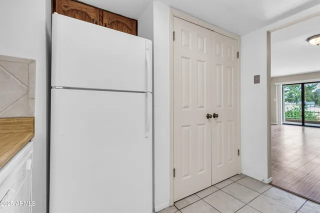 a kitchen with granite countertop a stove top oven microwave and cabinets