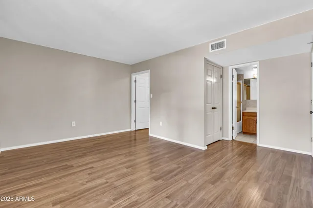 a bathroom with a sink vanity and shower