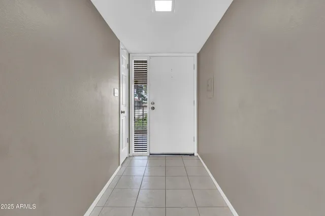 a kitchen with a sink a refrigerator a washer and dryer